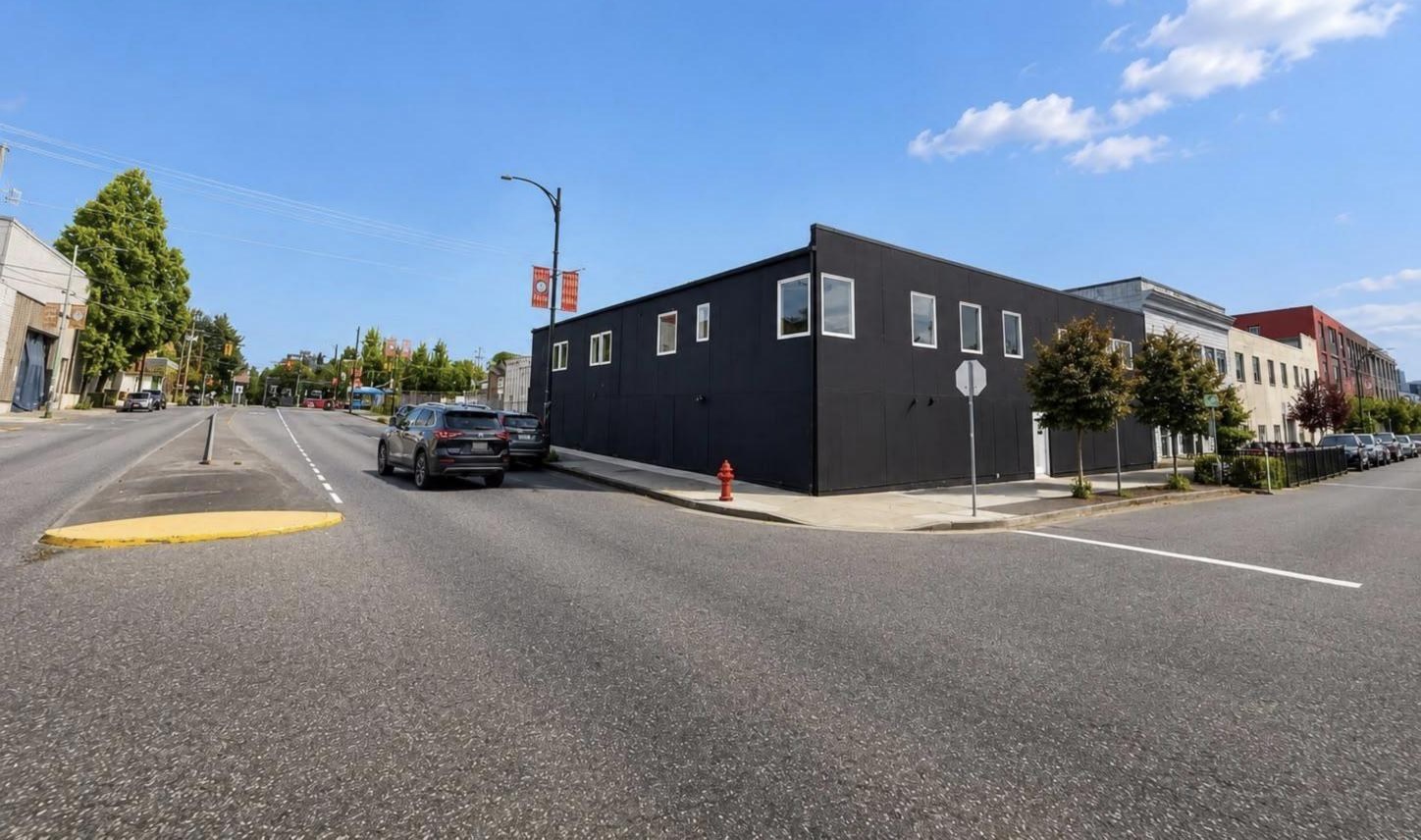 Black-clad corner industrial building at 1696 Franklin Street, Vancouver